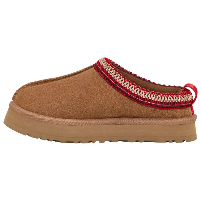 Medial side of UGG Youth Tazz Slipper in Chestnut Brown Suede