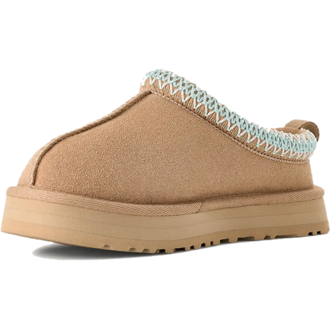 Medial side of UGG Youth Tazz Clog in Sand Suede
