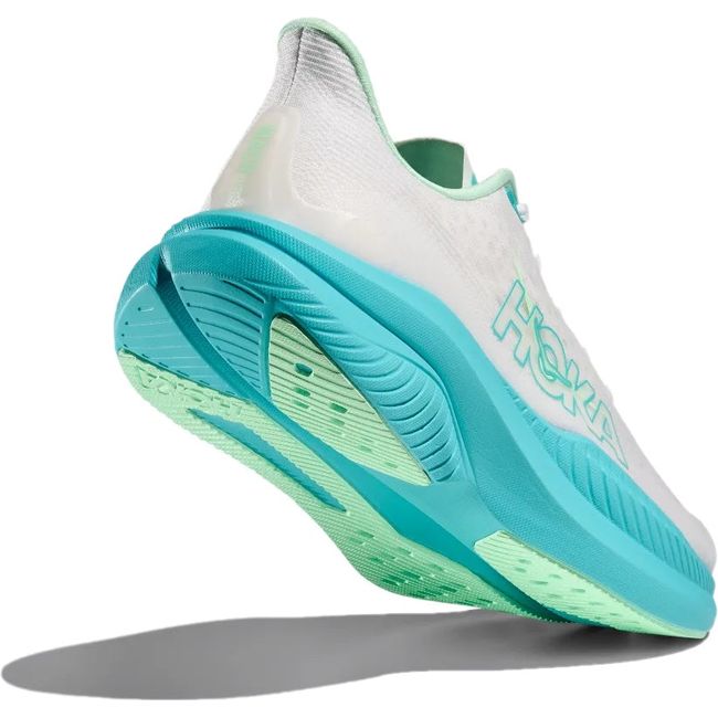 Heel angled up showing the sole of Hoka Women's Mach 6 Running Shoe in White Cielo Blue
