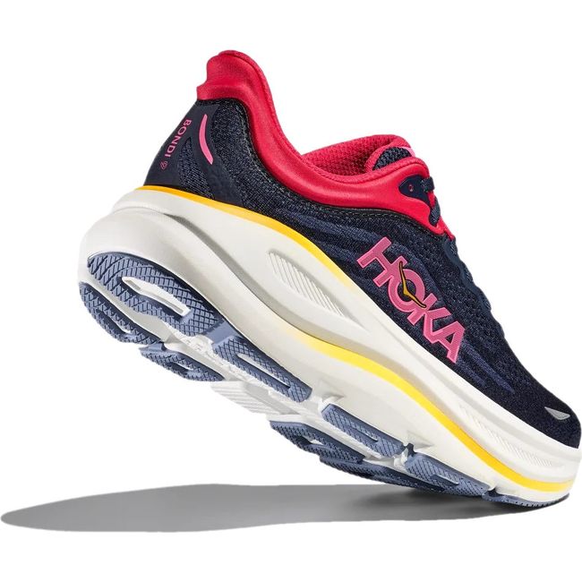 Heel angled up showing tread of Hoka Women's Bondi 9 Running Shoe in Varsity Navy Nautical Dusk