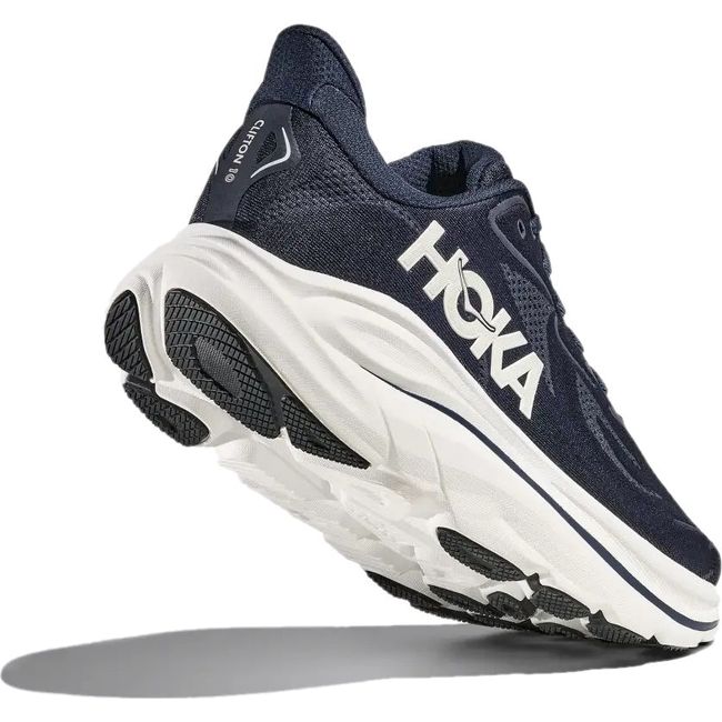 Heel angled up showing sole of Men's Hoka Clifton 10 Running Shoe in Navy and White