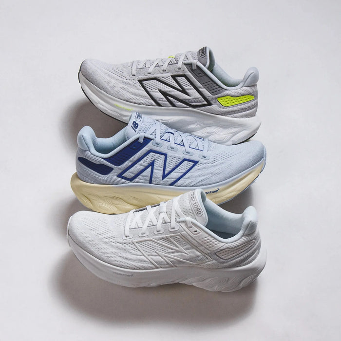 Three stacked New Balance Fresh Foam X 1080v14 on white background