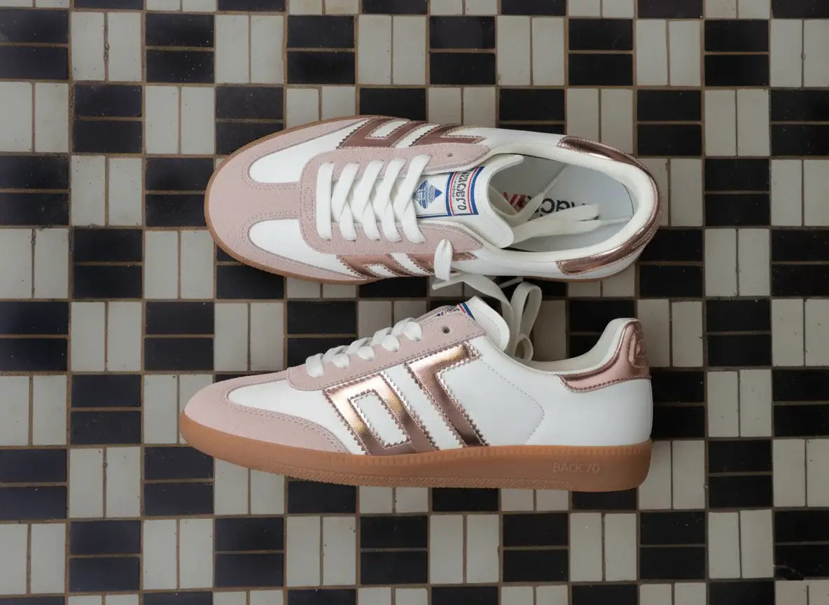 Retro Back 70 Cloud shoes with pink suede and metallic stripes, placed on patterned tiles.