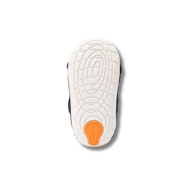 White sole of Stride Rite Kids' Soft Motion Turbo 2.0 Sneaker in Navy, Grey, and Orange