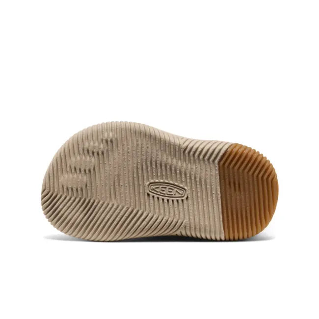 White sole of KEEN Toddlers’ KNX Middie Boot in purple Fig Lilas with pink faux wool