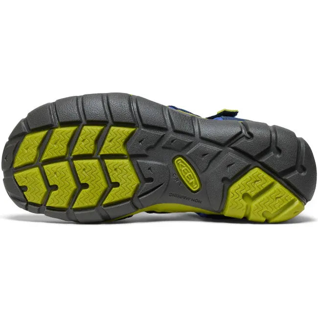 Sole of KEEN Youth Kids Seacamp II CNX Sandal in Naval Academy blue and Chartreuse green