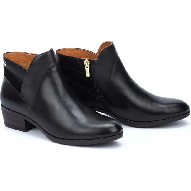 Pair of Women's Pikolinos Daroca Ankle Boot in black leather showing side zipper
