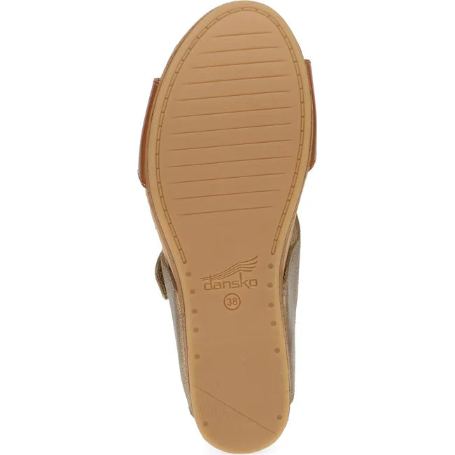 Sole of Women's Dansko Shannon Wedge Sandal in tan and gold upper with tan outsole