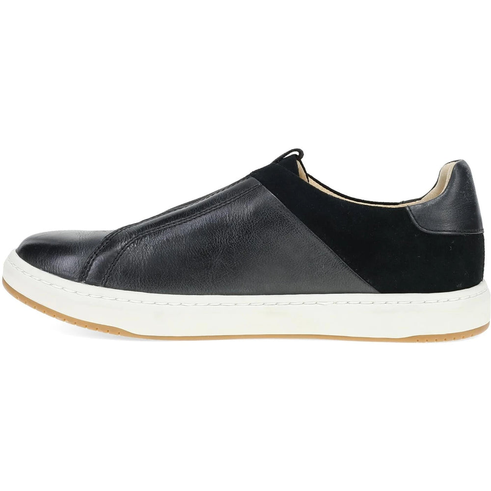 Dansko Women's Jenn Slip-On Sneaker in black leather, side view