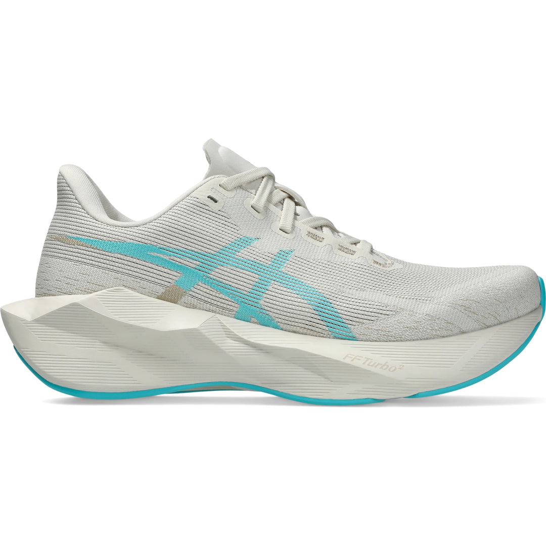 Side of ASICS Women's Novablast 6 Running Shoe in Soft Oat/Energy Aqua