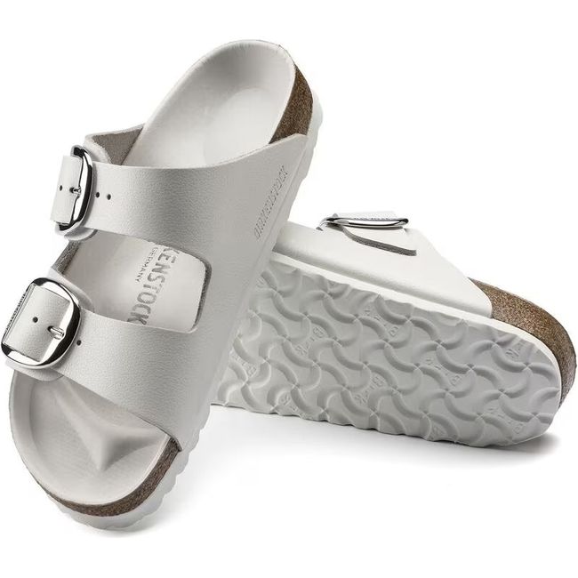 Upper and sole of Birkenstock Women&#39;s Arizona Big Buckle Sandals in White Leather