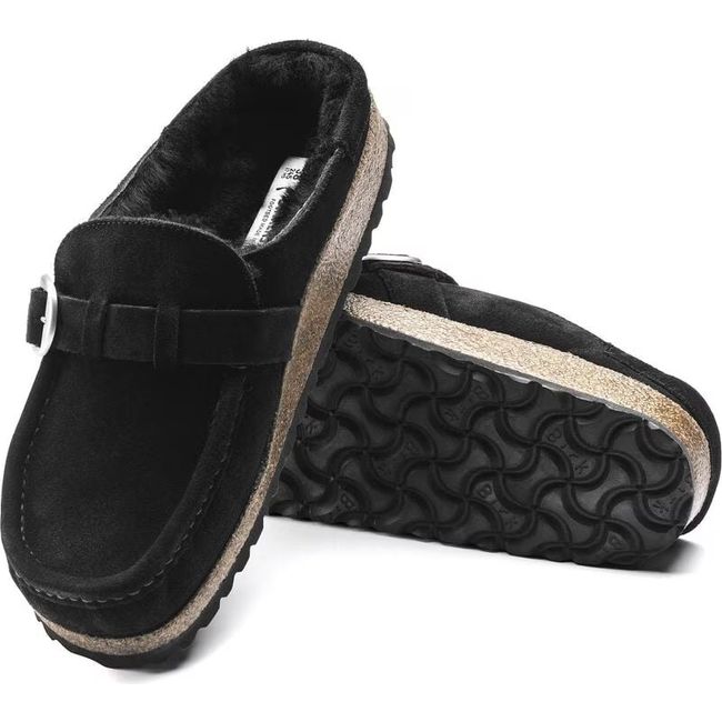 Pair of Birkenstock Women's Buckley Shearling Narrow Clogs in black suede showing upper and sole