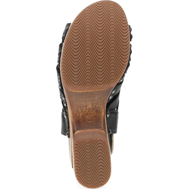 Sole of Women's Dansko Adie Heel in Black Calf leather. A gladiator style heel