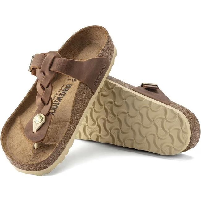 Upper and sole of Birkenstock Women's Gizeh Braid Oiled Leather Sandals in congac brown