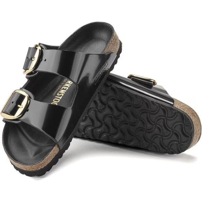 Pair of Birkenstock Women&#39;s Arizona Big Buckle High Shine Black Narrow Sandal showing upper and sole