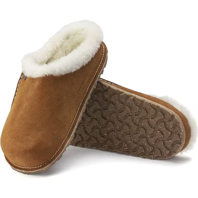 Pair of Women&#39;s brown suede Birkenstock Zermatt Premium Shearling Slippers showing sole and upper