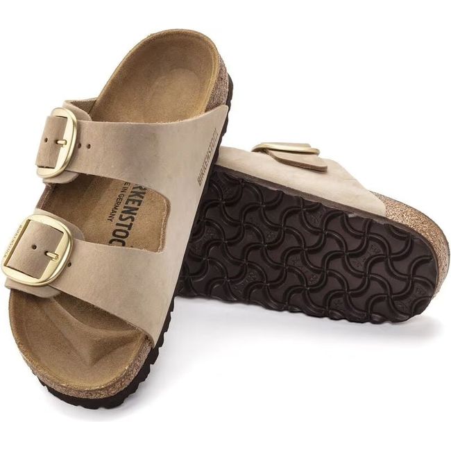 Upper and sole of Birkenstock Unisex Arizona Big Buckle Sandals in sandcastle beige