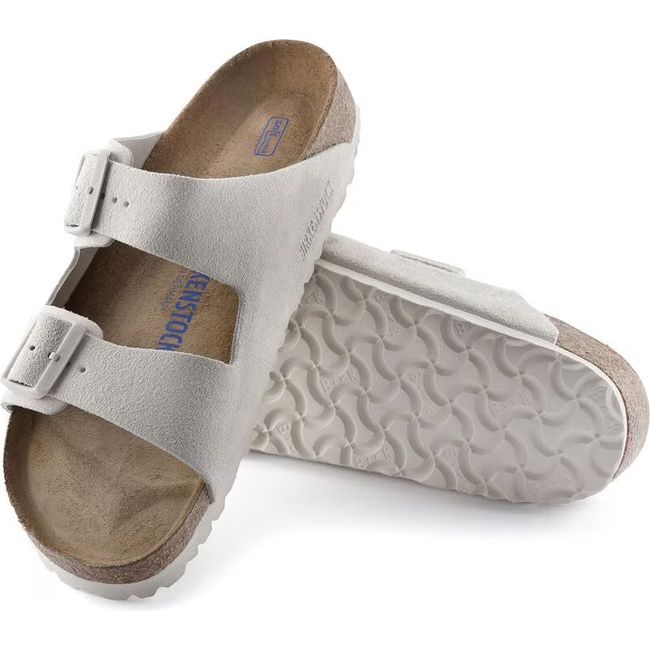 Upper and sole of Birkenstock Unisex Arizona Soft Footbed Sandal In Antique White Suede