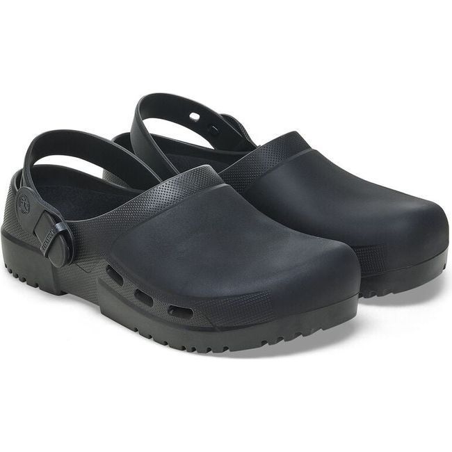 Angled view of a pair of jet black Birkenstock Unisex Birki Air 2.0 Professional Clogs featuring a fluid-resistant design ideal for healthcare and utility. The clogs include side air vents for breathability, a PU sole that is oil- and grease-resistant, a convertible backstrap, and adjustable detergent-friendly buckles.