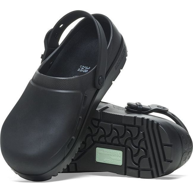 View of a pair of jet black Birkenstock Unisex Birki Air 2.0 Professional Clogs, with one shoe displaying the oil- and grease-resistant Polyurethane sole, while the other shoe leans against it to show the top view. The top showcases the contoured PU insole for comfort, fluid-resistant design for healthcare and utility, and side air vents for breathability. Both clogs feature adjustable detergent-friendly buckles and convertible backstraps.