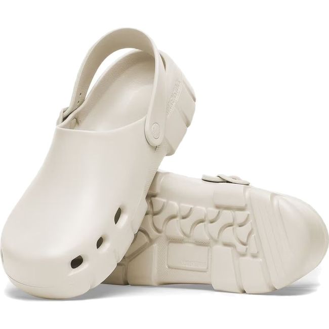 Pair of Unisex Birki Flow Birkenstock Recovery Clog in eggshell white showing upper and sole