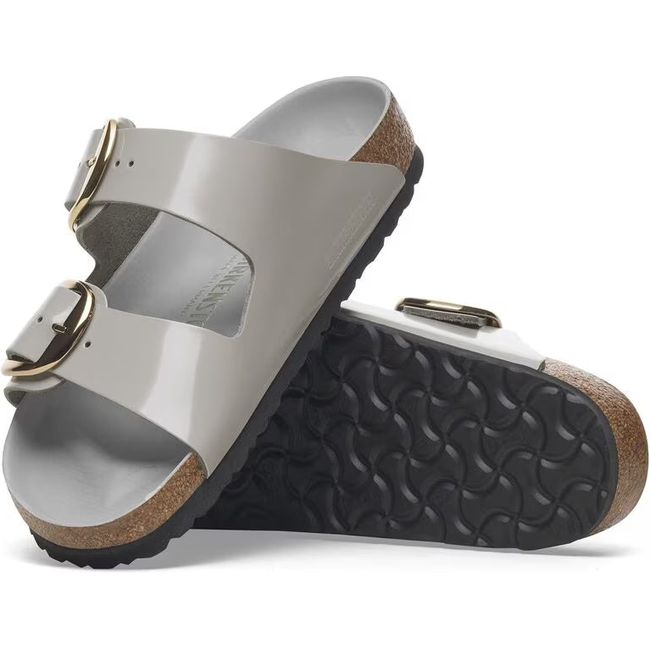 Upper and sole of Birkenstock Women&#39;s Arizona Big Buckle Narrow Sandals in high shine stone coin
