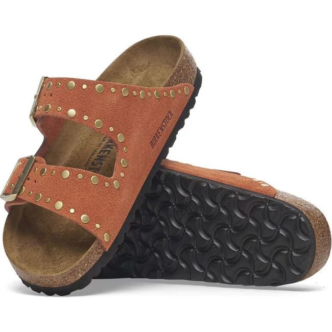 Upper and sole of a Birkenstock Women's Arizona Rivet Narrow Sandals in dark rust orange