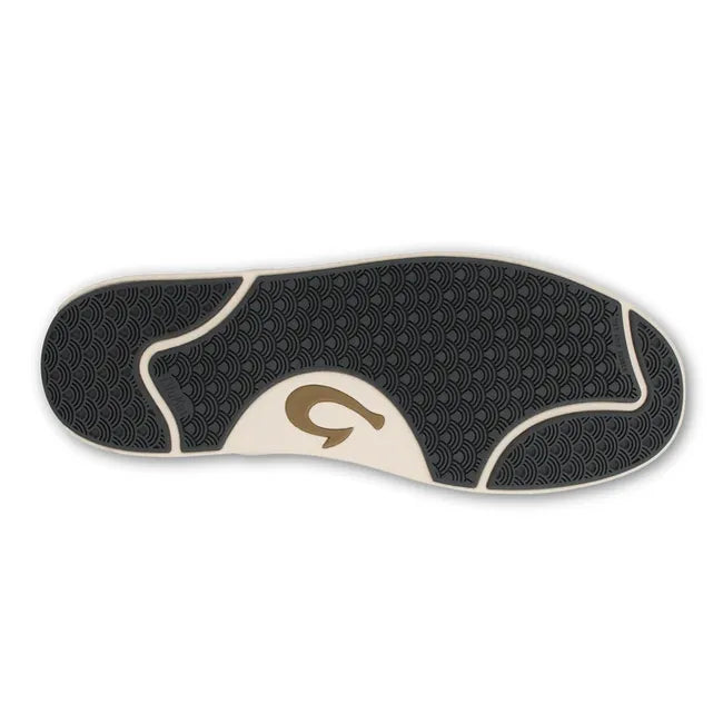 Sole of Men's Olukai Laeahi Kapa slip on shoe with a white sole and black tread