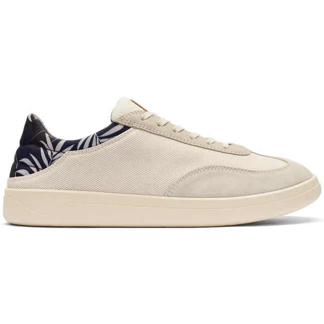 Lateral side of Men's Olukai Punini Shoe in Off White Aloha upper with a white sole