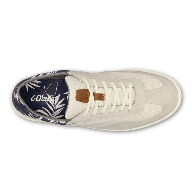 Top down view of Men's Olukai Punini Shoe in Off White upper and a navy leaf pattern inner lining