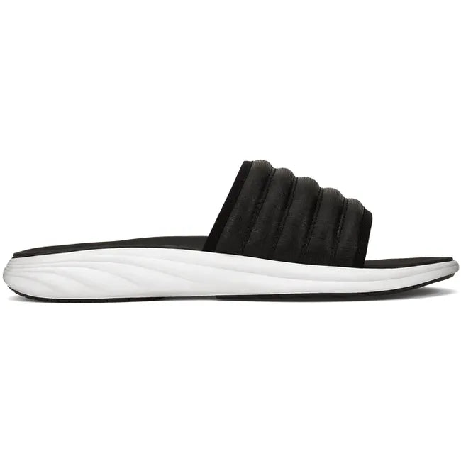 Lateral side of Water-Resistant Black OluKai Komo Slide with white sole