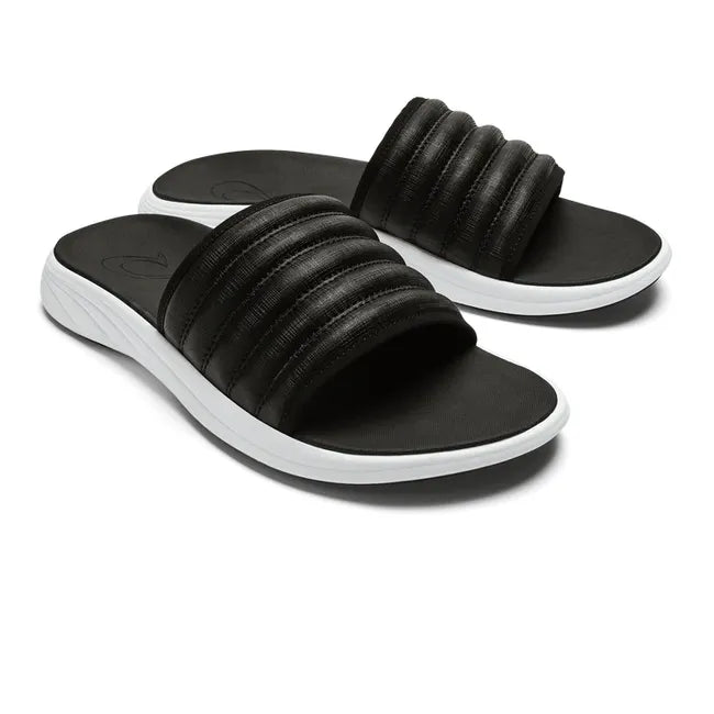 Pair of Water-Resistant Black OluKai Komo Slide with white sole