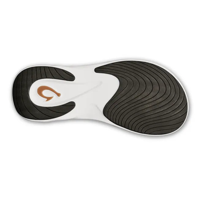 Sole of Water-Resistant Black OluKai Komo Slide in white with black tread