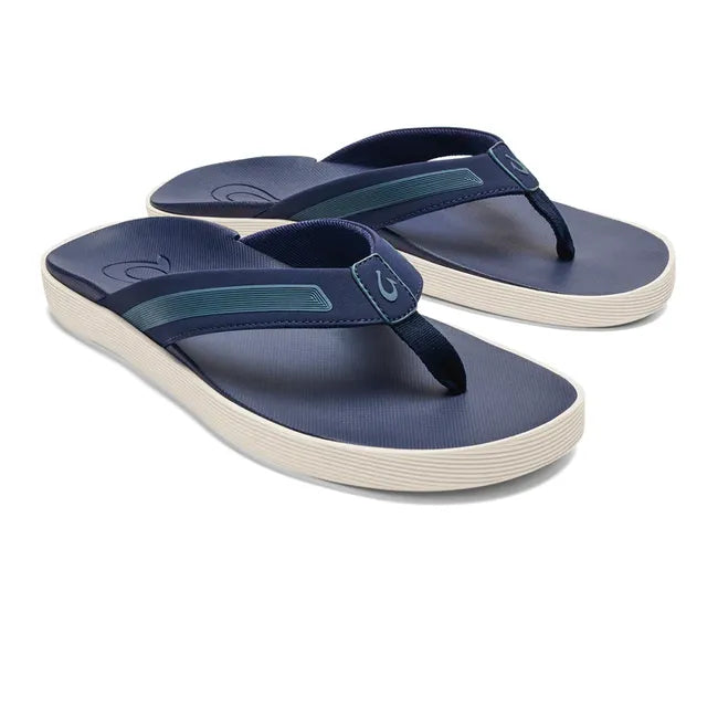 Pair of Men's Olukai Leeward Flip Flop Beach Sandal in navy with a white sole