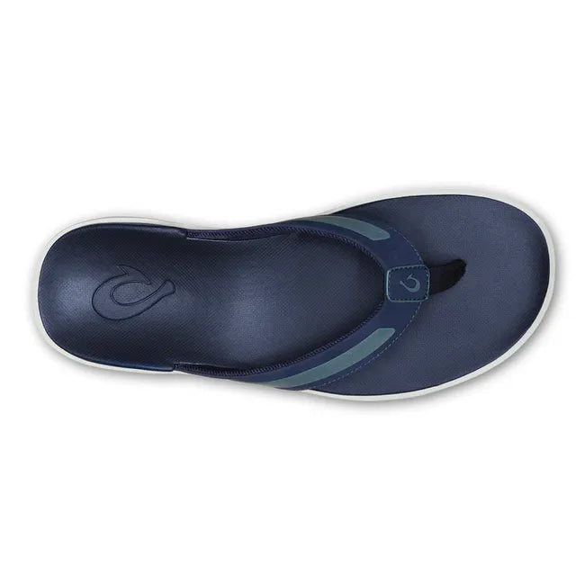 Top down view of Men's Olukai Leeward Flip Flop Beach Sandal in navy with a white sole