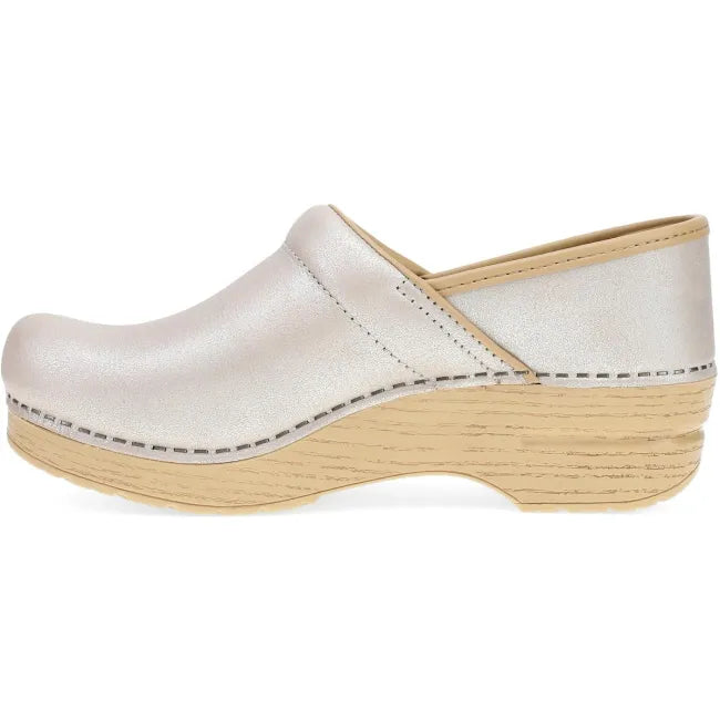 Dansko Professional clog in pearl metallic leather, side profile showing rocker bottom