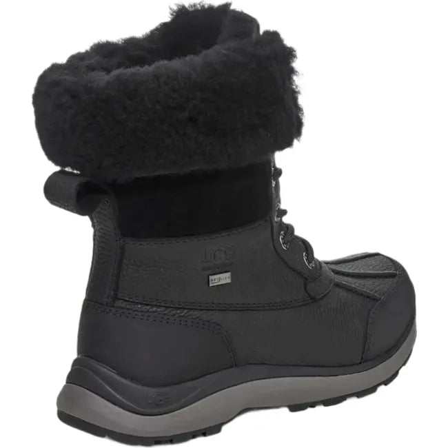 Heel angled view of Women's Ugg Adirondack Boot III Waterproof leather in black. Lace closure