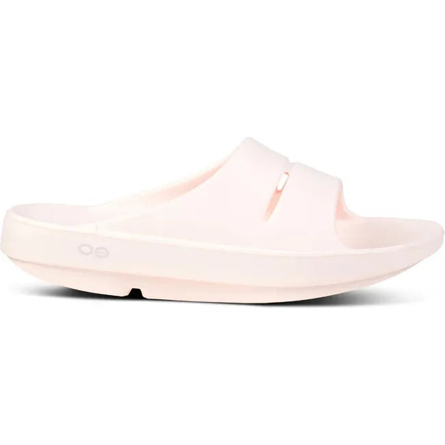 Lateral side of Unisex OOfos OOahh Slide Sandal in Blush Pink