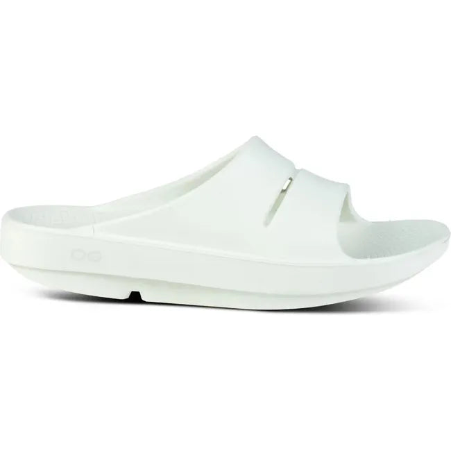 Lateral side of Unisex OOFOS OOahh Slide Sandal in mint green