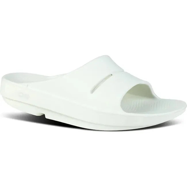 Front angled view of Unisex OOFOS OOahh Slide Sandal in mint green