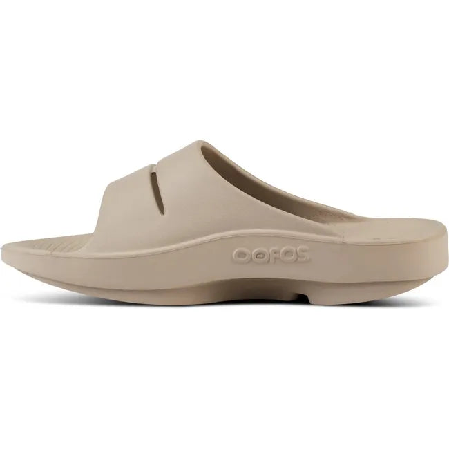Medial side of Unisex OOfos OOahh Slide Sandal in Nomad Beige