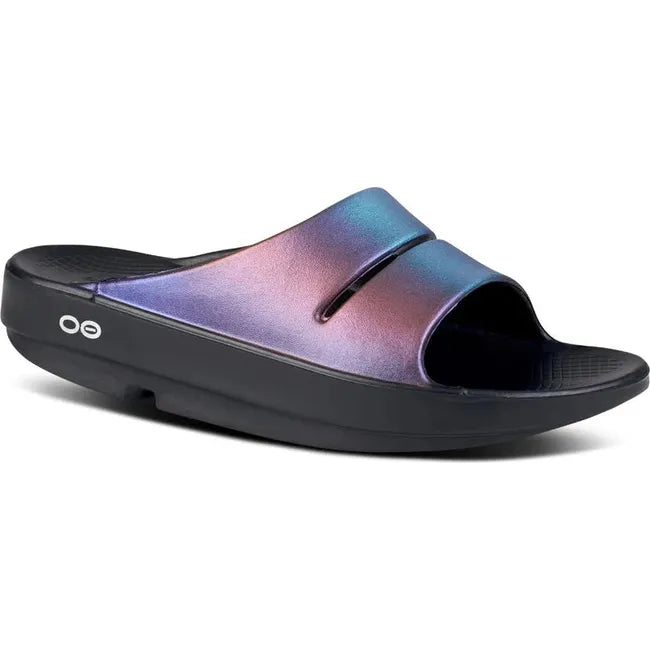 Front angled view of Women's OOFOS OOahh Luxe Slide Sandal in midnight spectre multi color
