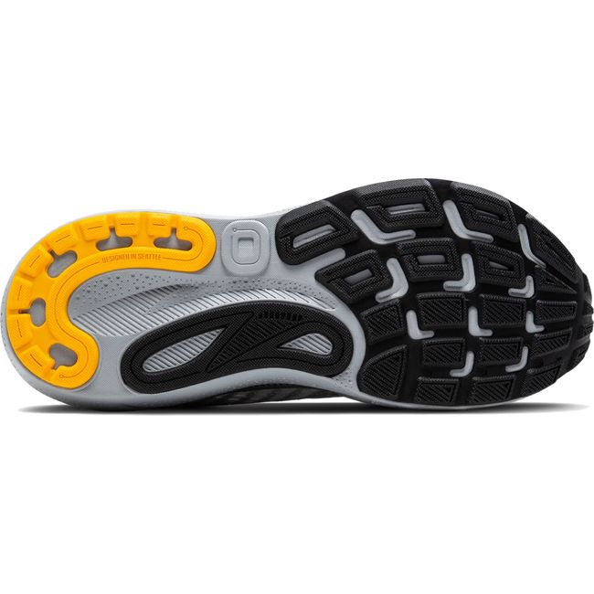 Sole of Men&#39;s Brooks Adrenaline GTS 24 running shoe in grey with black and yellow tread