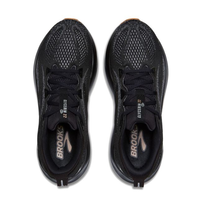 Upper of Brooks Men’s Glycerin 22 black running shoe with lace-up and cushioned midsole.