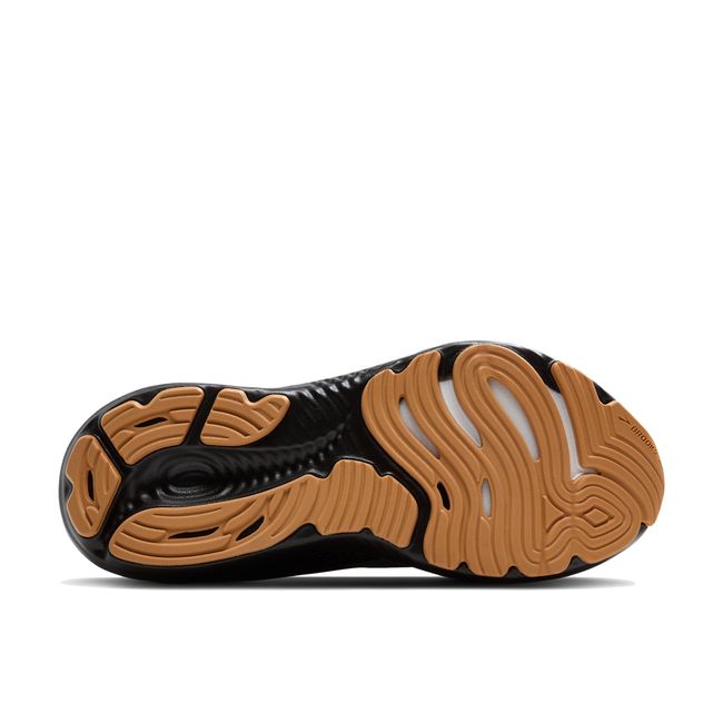 Sole of Brooks Men’s Glycerin 22 black running shoe showing tan tread and cushioned support midsole.