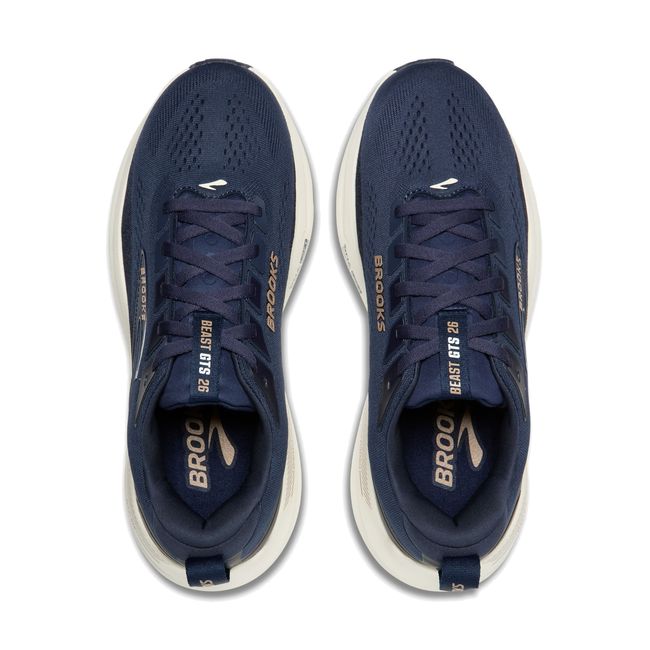 Top-down pair of Brooks Beast GTS 26 in peacoat navy showing roomy mesh upper with gold Brooks logo detail
