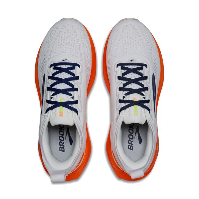 Top-down pair view of Brooks Glycerin 23 in white showing mesh upper, navy laces, and orange midsole