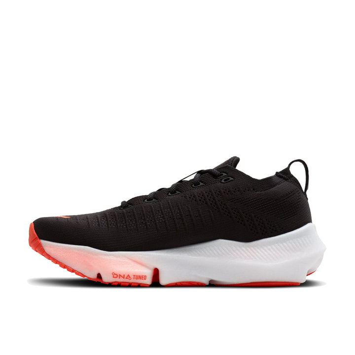 Medial side profile of Brooks Glycerin Flex in black and orange showing midfoot flex groove and midsole stack