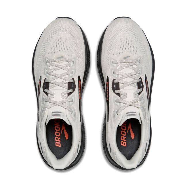 Top-down pair of Brooks Ghost 18 in coconut white showing mesh upper with black laces and orange Brooks logo accent