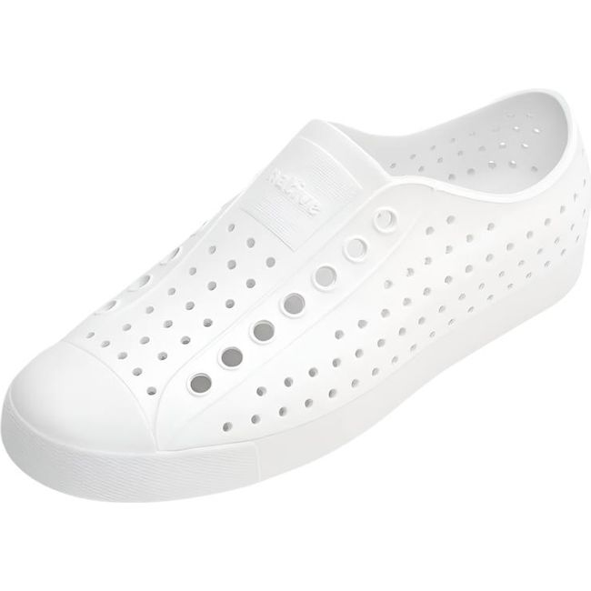 Overhead view of the Native Big Kids' Jefferson Shoe in shell white, featuring a slip-on design, lightweight and hand-washable Sugarlite™ material, a perforated upper similar to Crocs, and a white toe cap for added design.